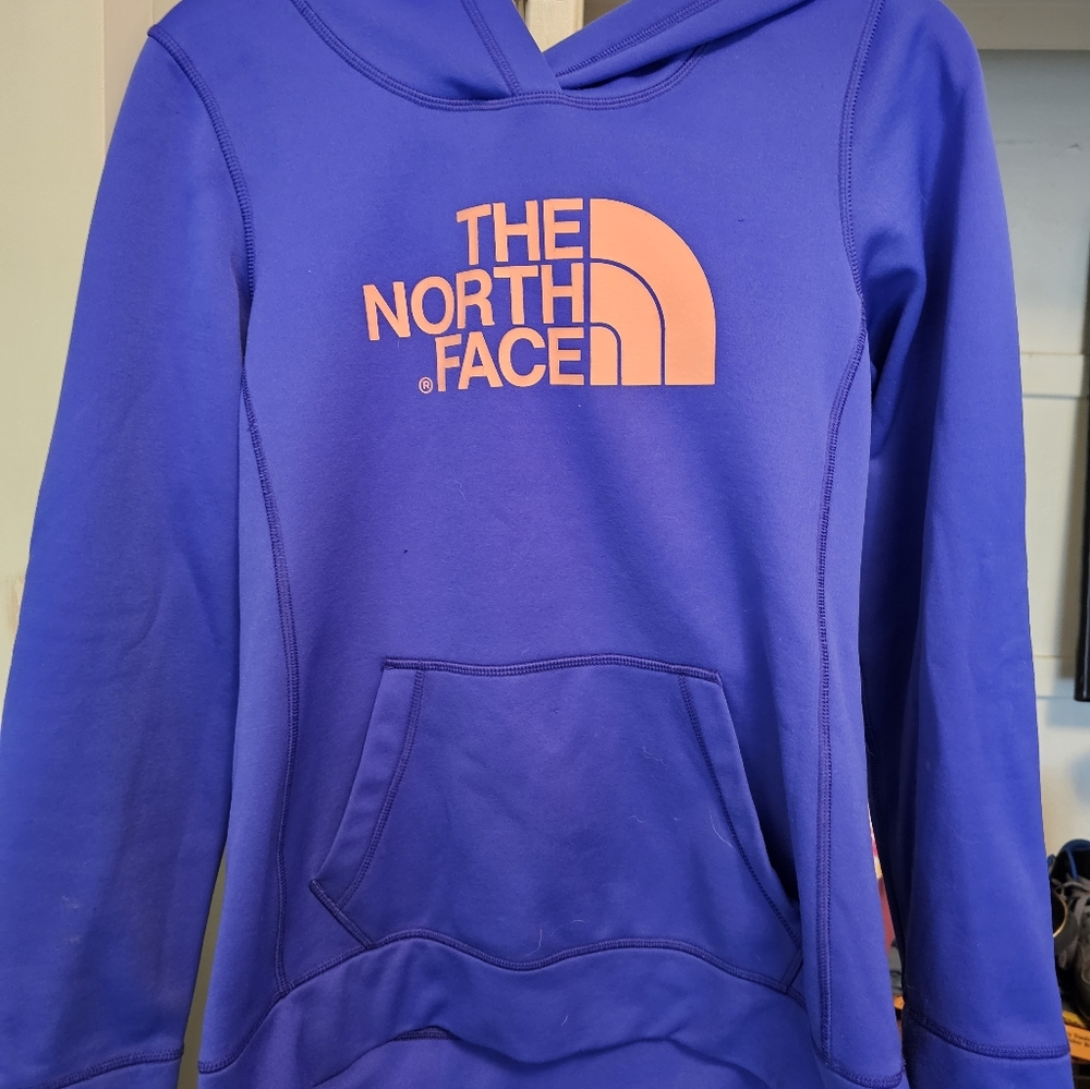 The North Face  pull over hoodie in fantastic condition. Bright blue and orange